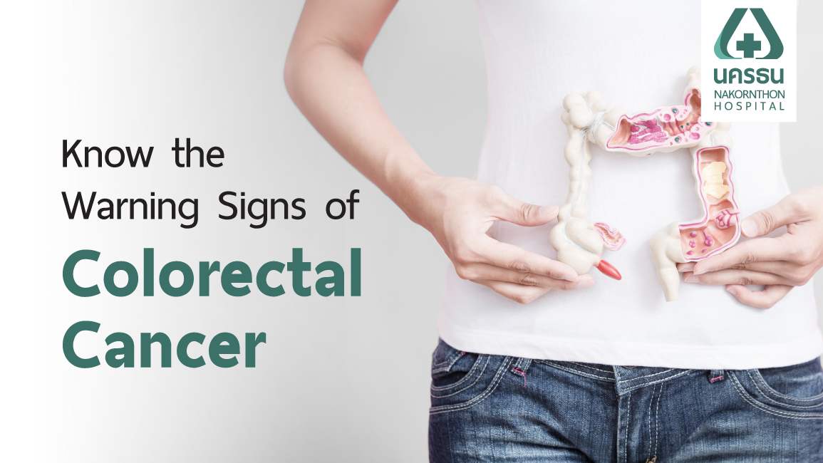 A woman with an anatomical model for colorectal cancer. Several symptoms can be present