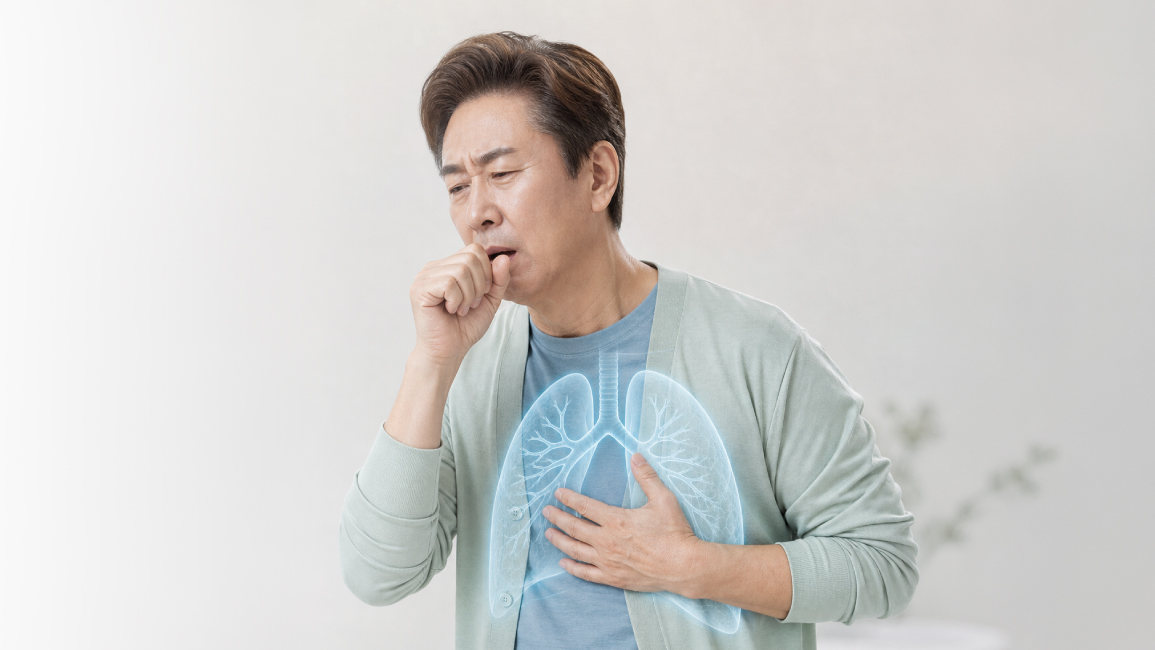 Adult coughing, illustrating an early symptom of lung cancer that warrants medical evaluation.
